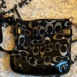 Coach Black and Silver Crossbody Bag with Signature Design